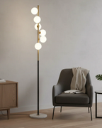Lampadaire moderne à 6 boules blanches en verre noir et doré